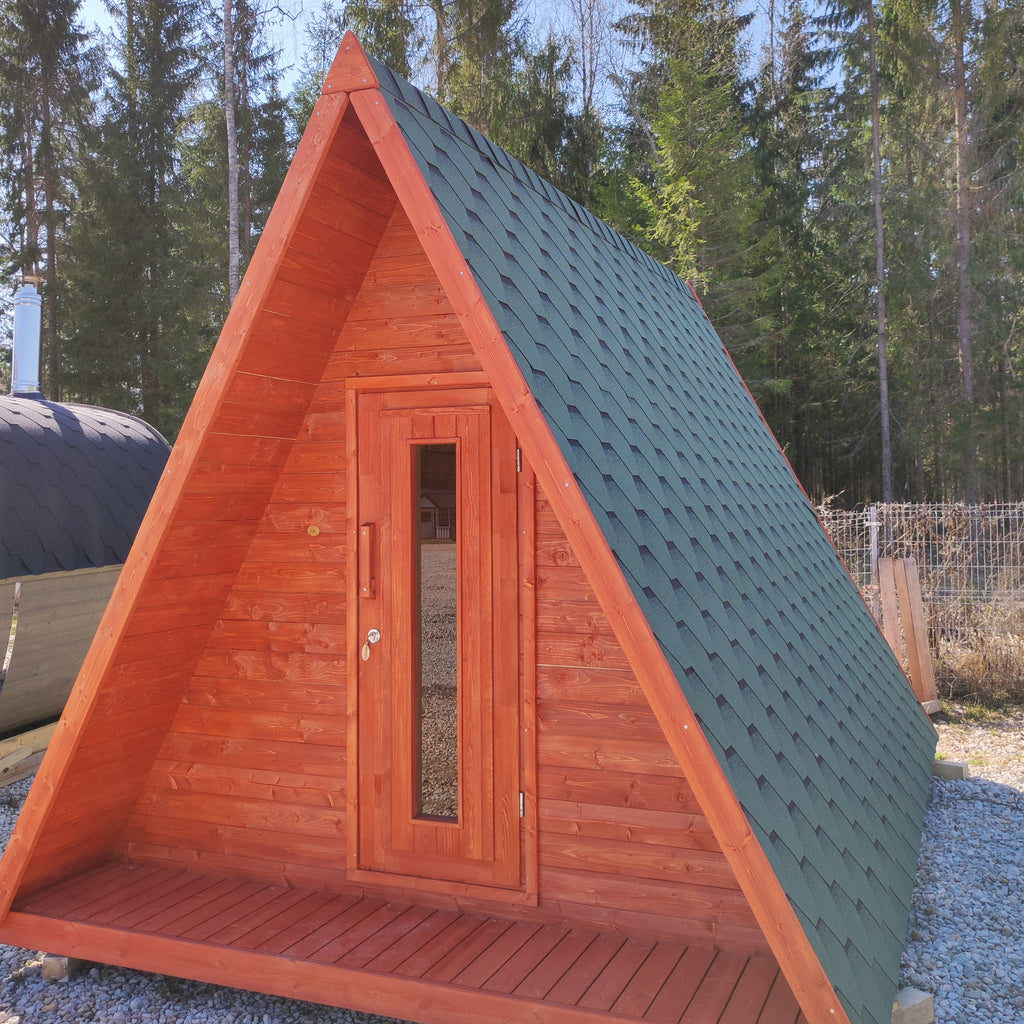 Spacious Wigwam constructed from premium 28mm Nordic Spruce, set amidst a lush green landscape.