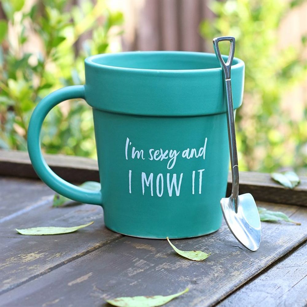 Close-up of the mug and spoon set against a garden backdrop, encapsulating the essence of horticultural humour.