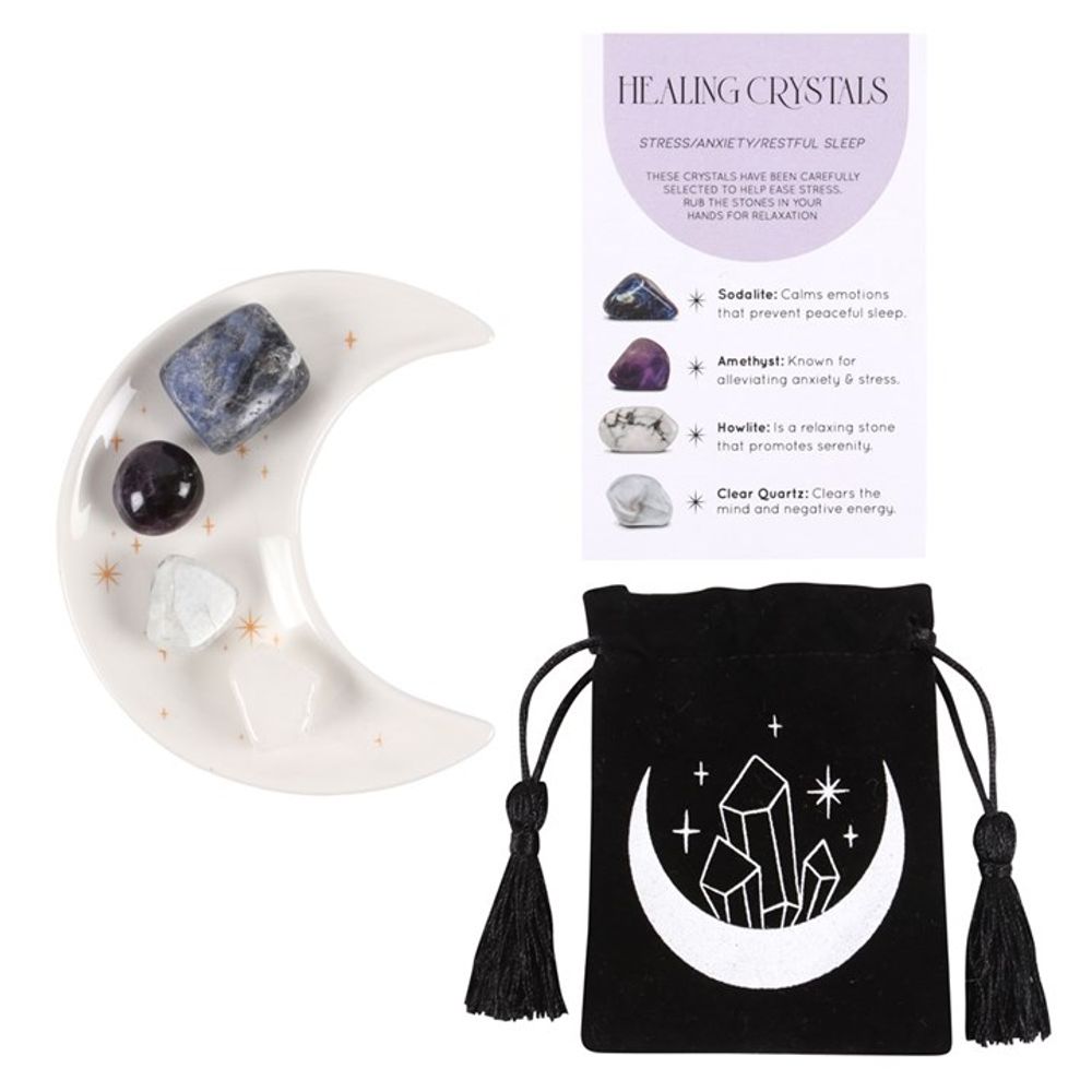 KeiCo's collection of healing crystals displayed on the crescent moon trinket dish, radiating calm energy.