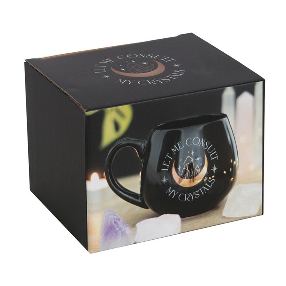 A magical beverage experience with the 'Let Me Consult My Crystals' Black Mug, a perfect gift for crystal enthusiasts.