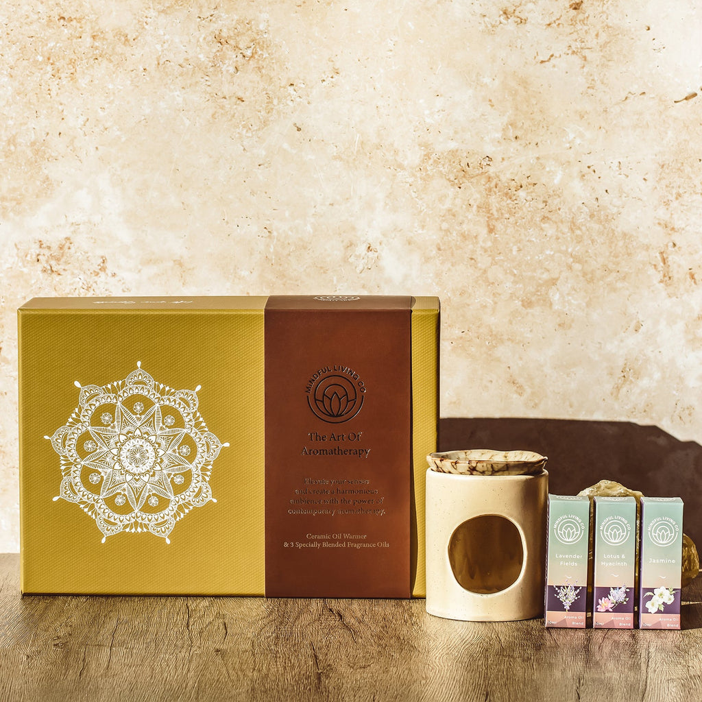 KeiCo oil warmer gift set displayed on wooden tray with calming decor.