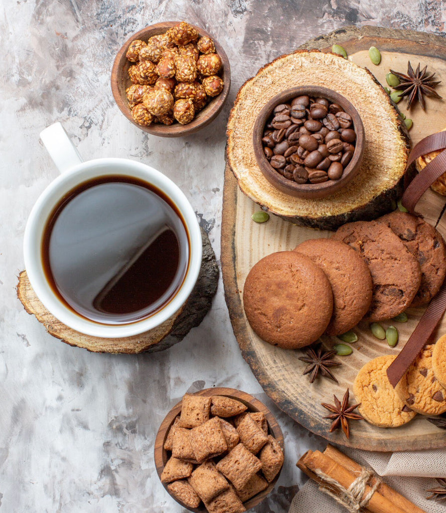 An array of sweet treats from the Coffee Lovers Gift Bag Hamper, ready to pair with a cup of espresso.