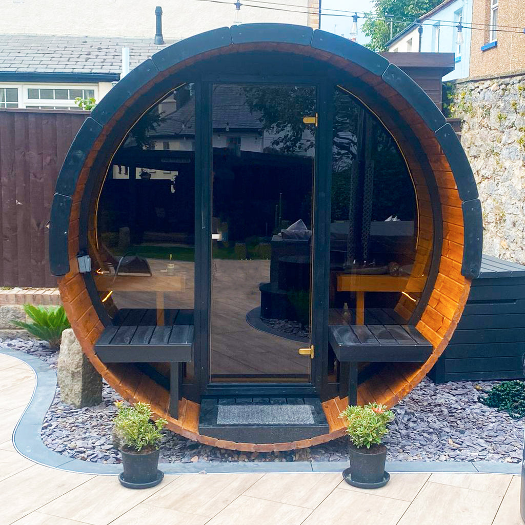 The KeiCo Deluxe 280 Sauna full glass frontage finished in Sadolin Ebony Wood Treatment