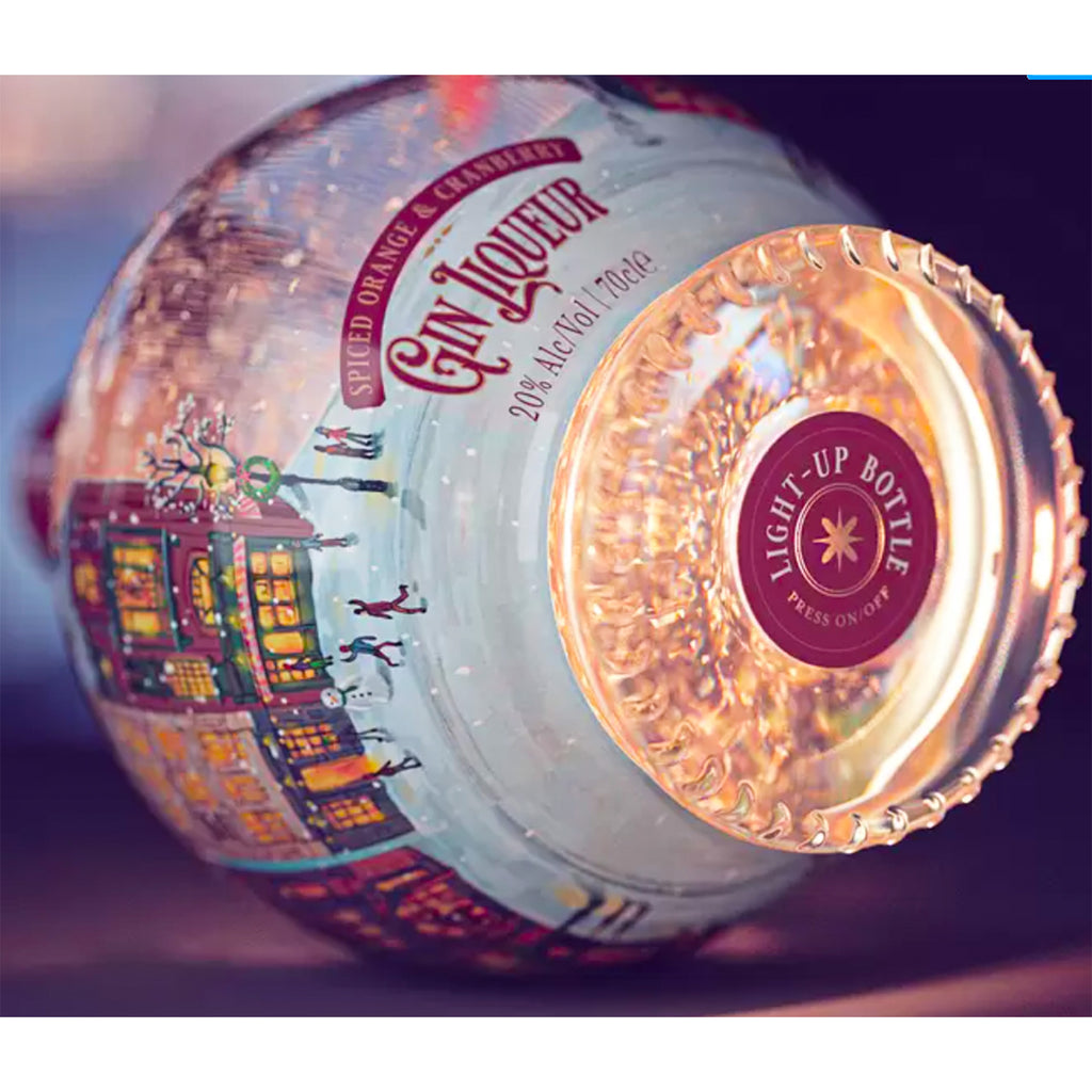 Close-up of the exquisite KeiCo Starlit Christmas Globe Bottle with Orange & Cranberry Gin Liqueur.