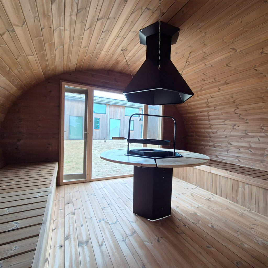 Enclosed Hobbit Grill-House Featuring Glass French Doors and Fire Bowl