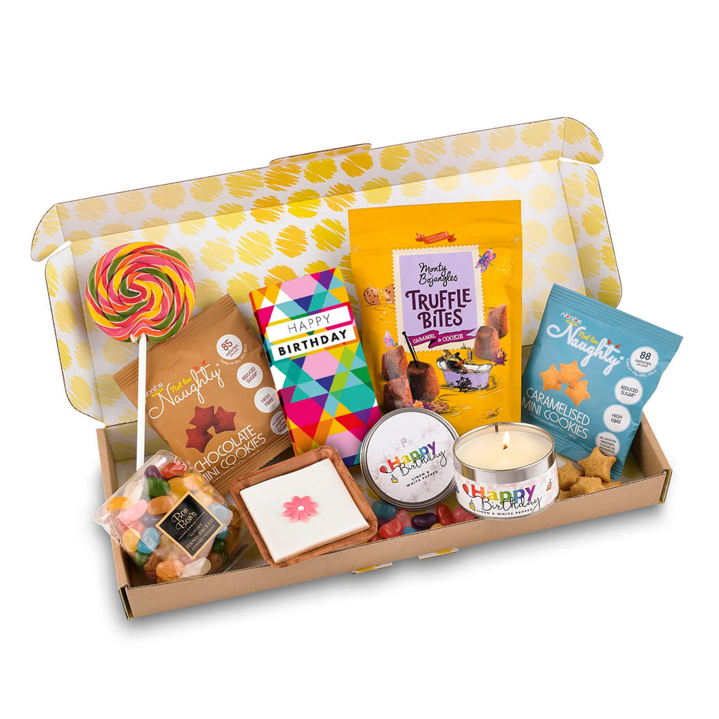 A colorful array of birthday treats from the Letterbox Birthday Delight gift box, showcasing the candle, cake, and candies.