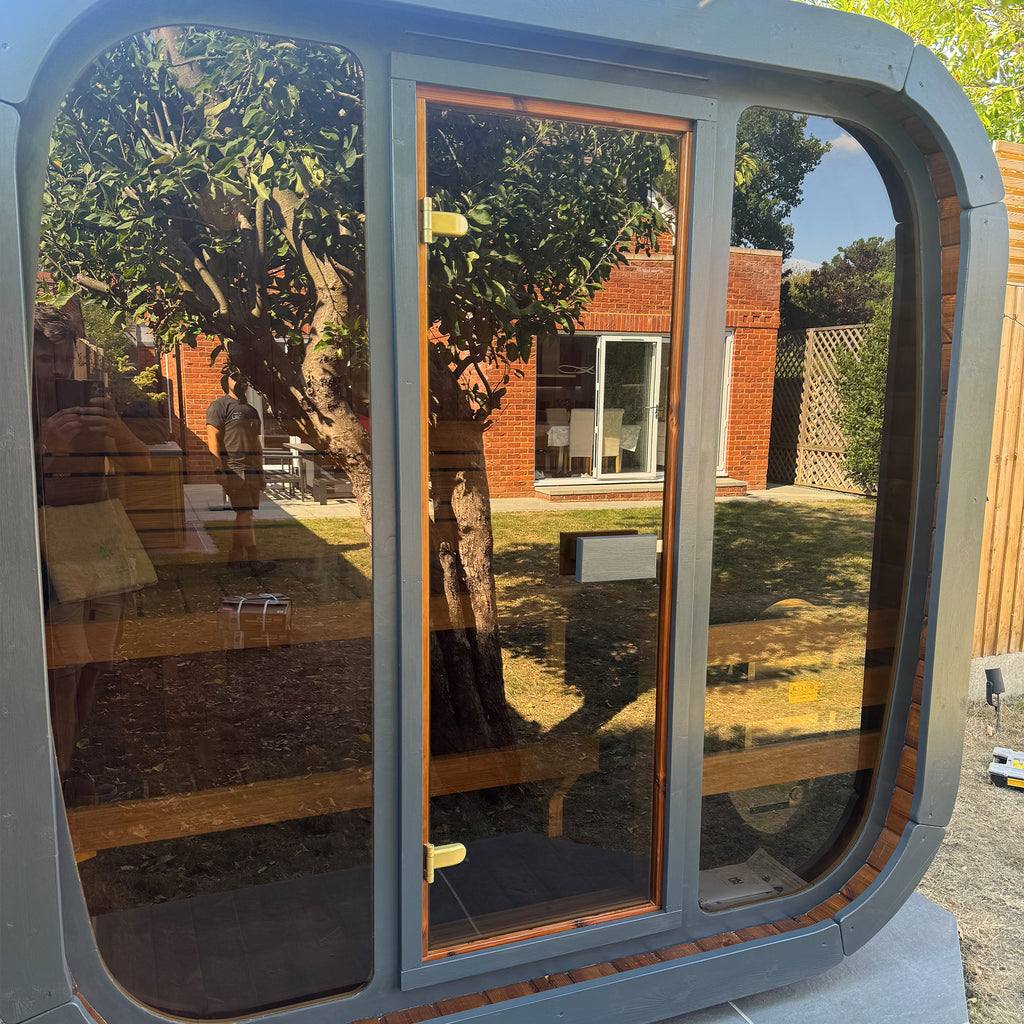 Small modular KC 125 Sauna building with full glass fronted window with anthracite detailing to fascias.