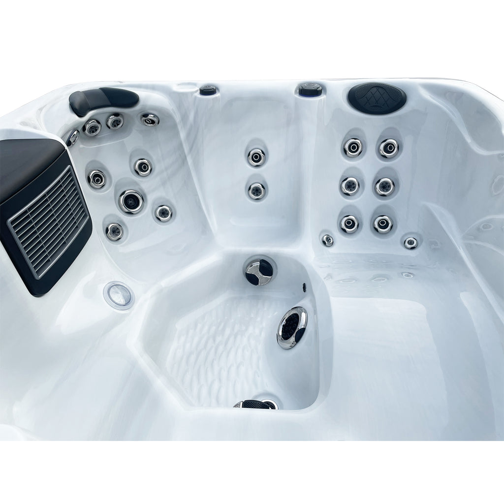 Relaxing in the KC-11 Bliss Spa - 6-Person Hot Tub, showcasing the 4 seats + 1 lounger layout.