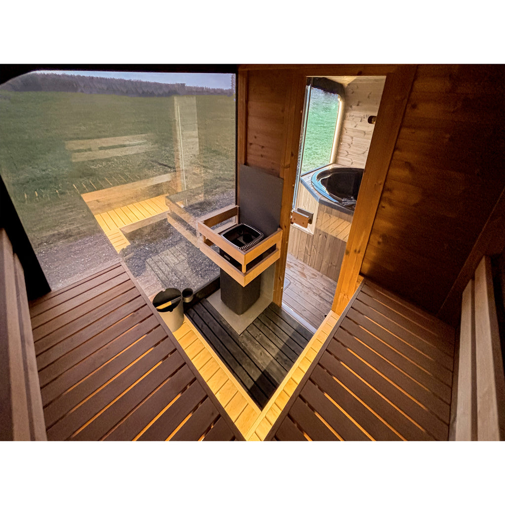 Interior view of KC NEST sauna with glass partition and wooden benches