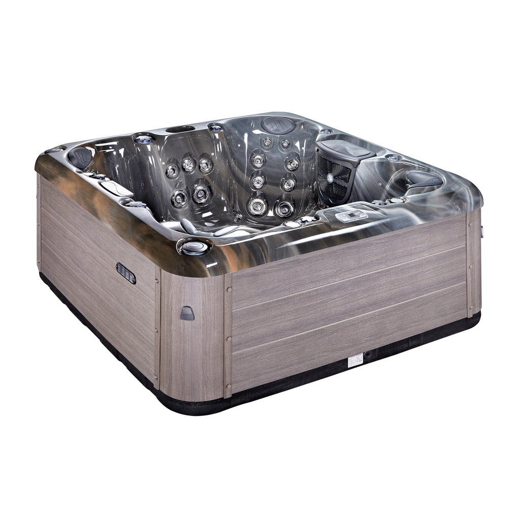 KC-2 Solace Spa Plus 7-person hot tub installed in a garden setting, showing compatibility with outdoor living spaces.