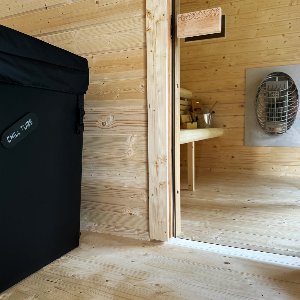 Spacious thermal retreat with separate sauna and cold plunge spaces crafted in natural timber