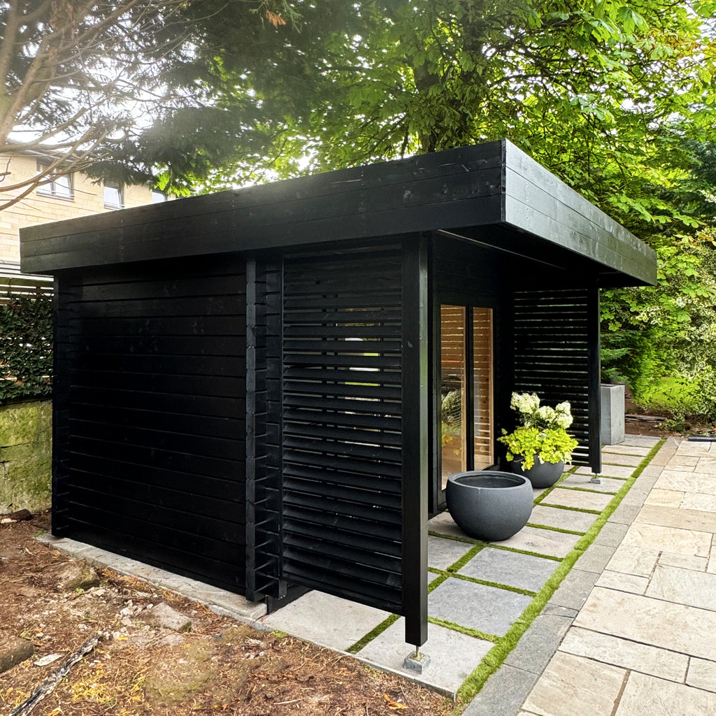 Garden-installed KC Kaldera with dual entry doors and sleek Nordic design for outdoor wellness