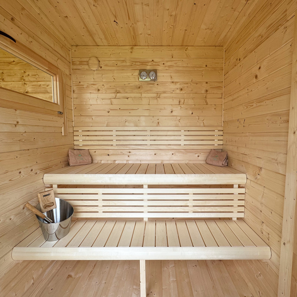 Nordic-style sauna with timber benches and glazed door