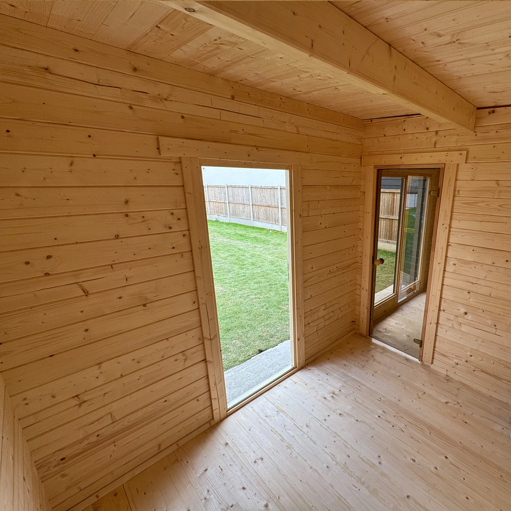 Interior gym/yoga room showing warm timber cladding and daylight