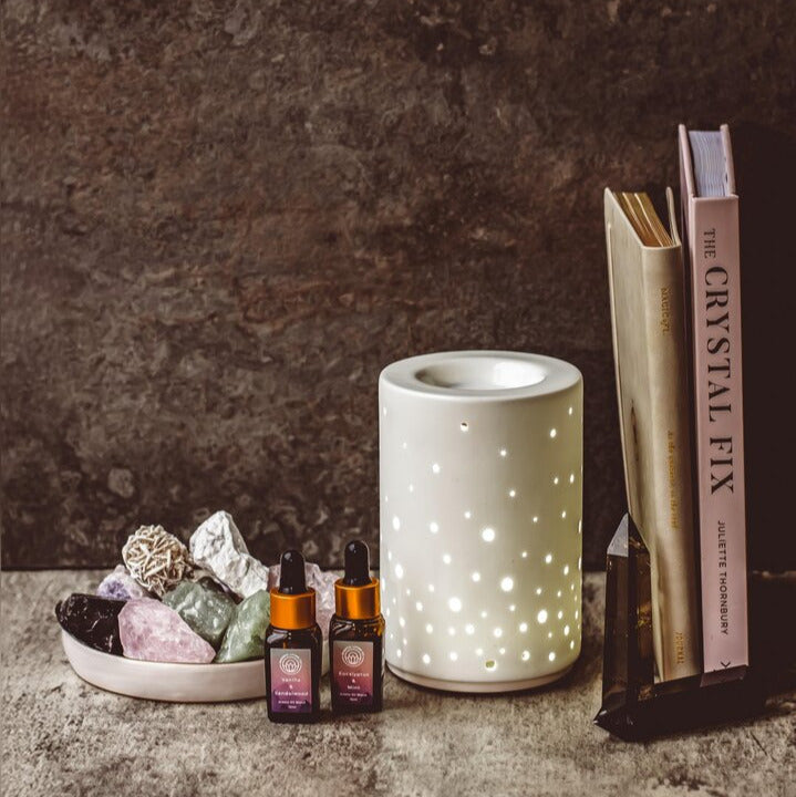 Starlight ceramic electric oil burner glowing with constellation light