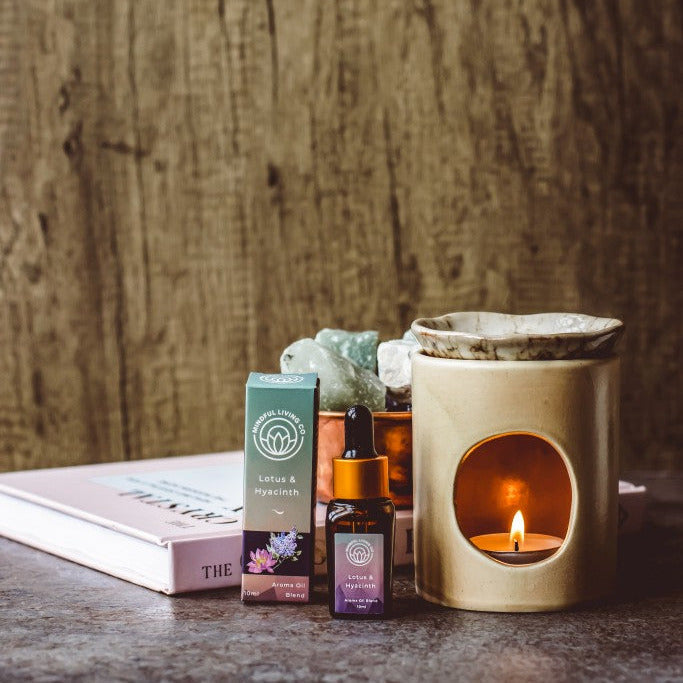 Lotus & Hyacinth scented oil bottle with blue-violet florals and burner – balanced and serene.