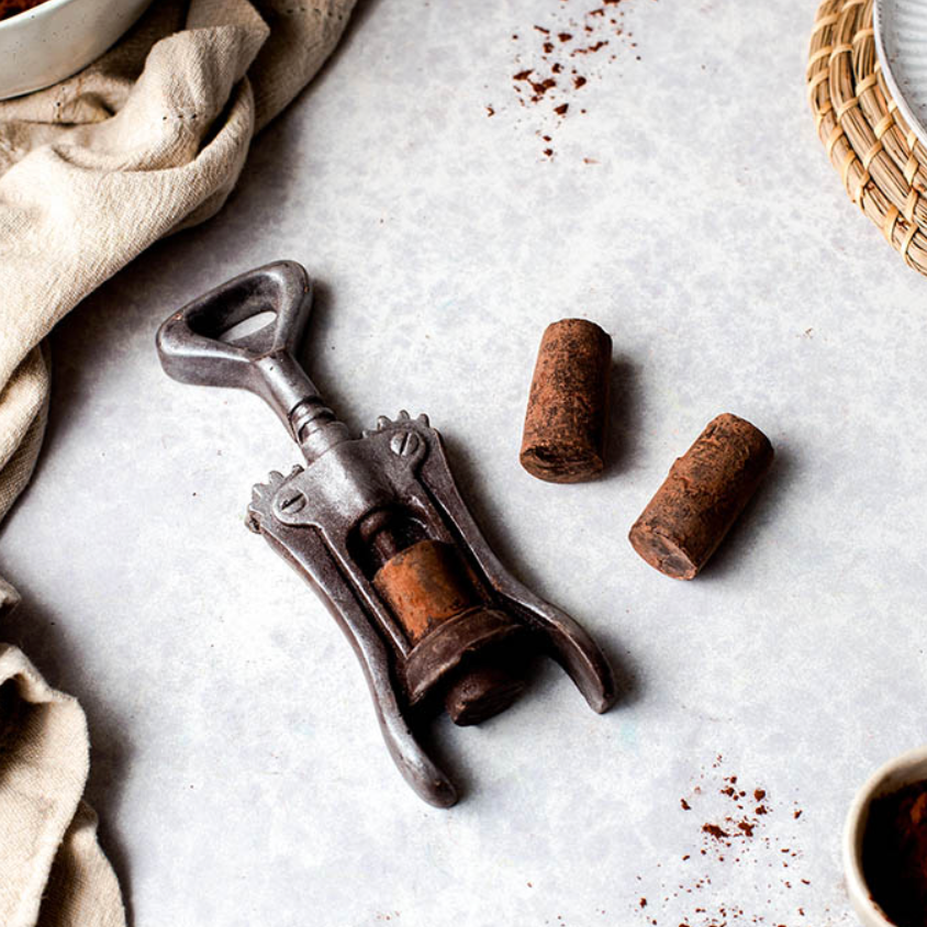 Wine-themed novelty chocolate gift set styled with bottle and glasses