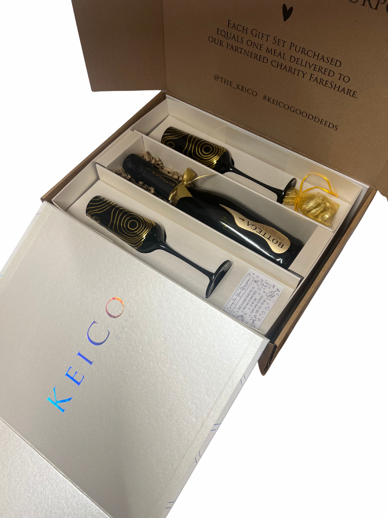 Keico Gifts in a box with branding and charitable message.