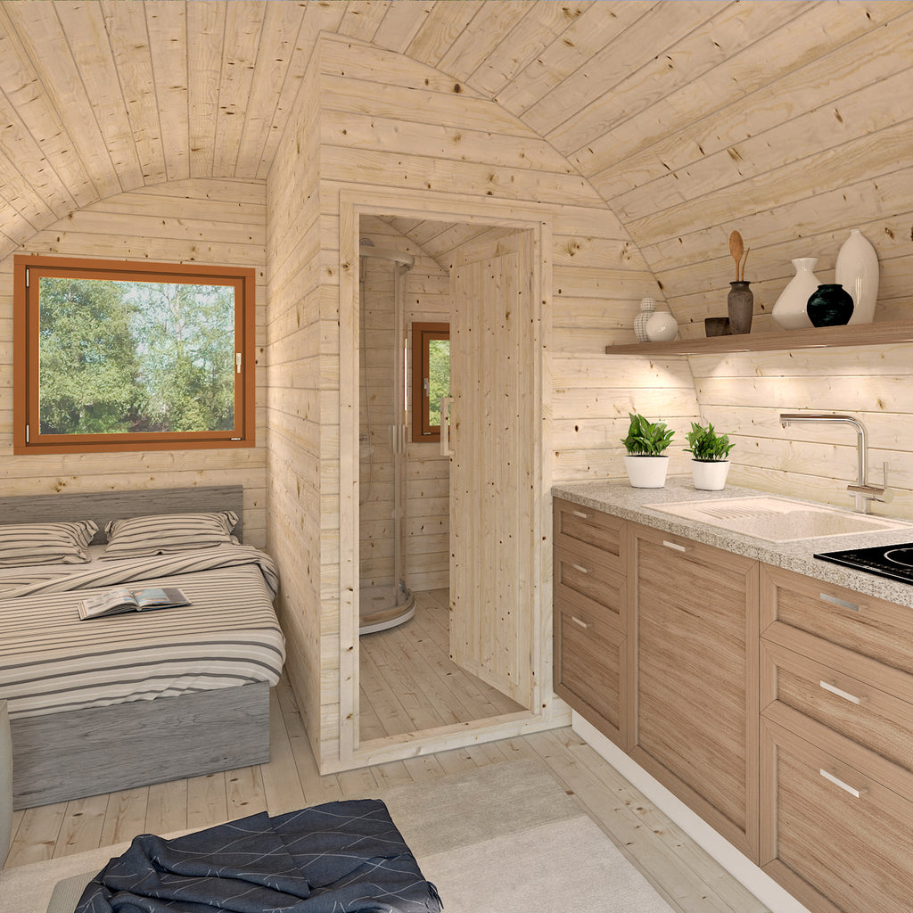 Interior view of KeiCo Glamping Pod highlighting the Nordic Spruce lining.