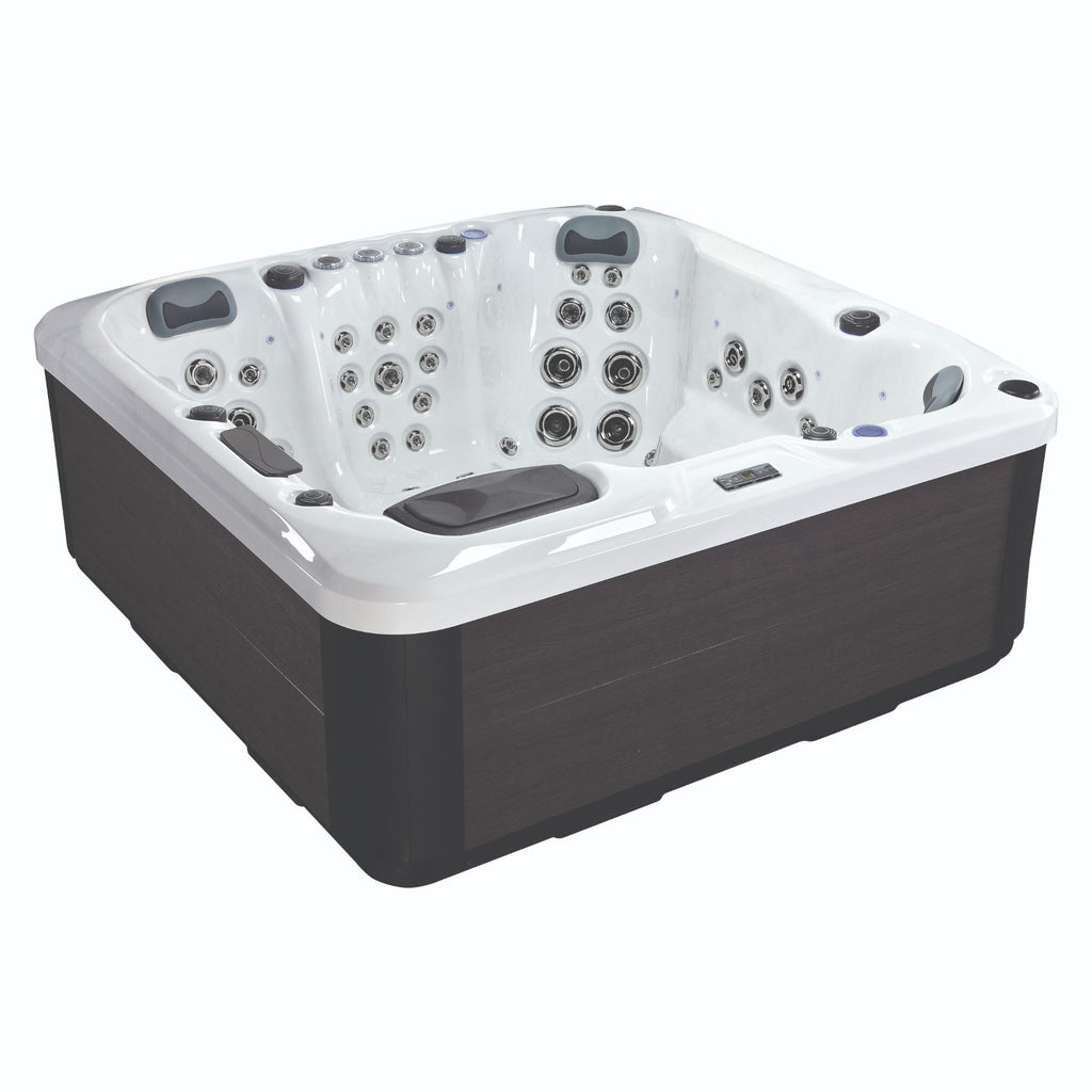 KC10 Ultimate hot tub with lounger and ergonomic seating – angled view