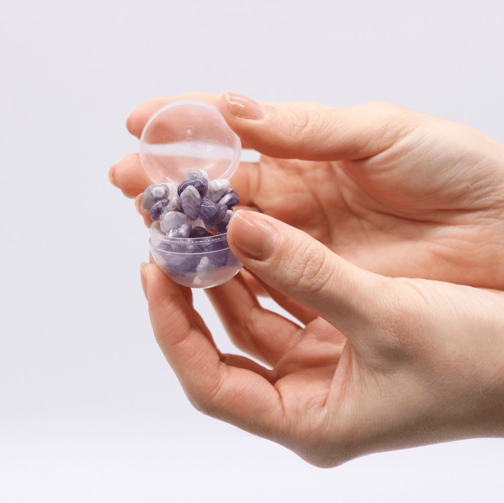 Close-up of the bath bomb revealing hints of the precious gemstone bracelet within.