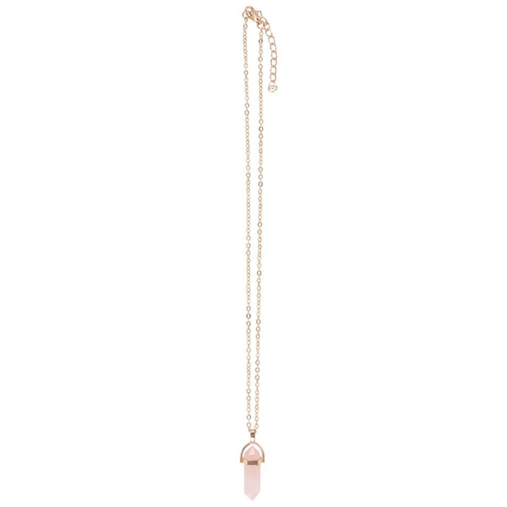 KeiCo's elegant gold-tone necklace with rose quartz pendant, draped gracefully over the blank greeting card.