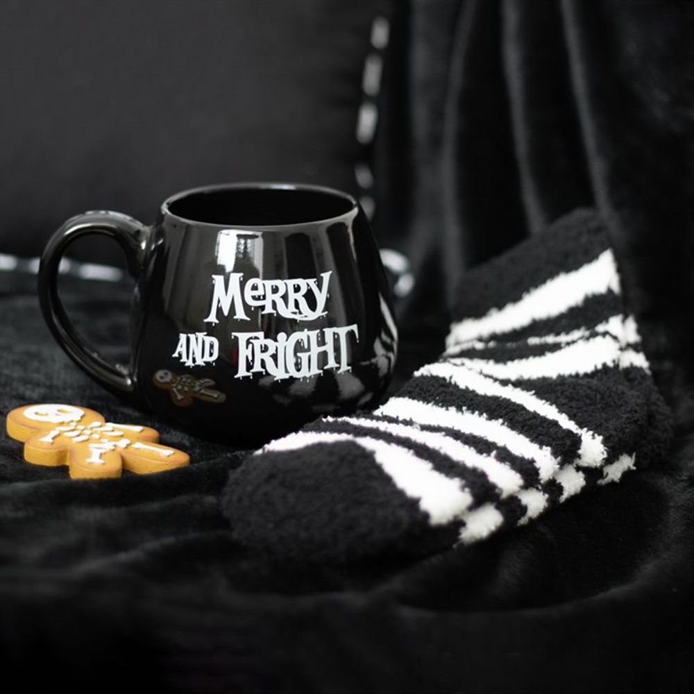 Soft and fluffy black and white striped socks from the Merry and Fright set, promising warmth with a touch of gothic charm.