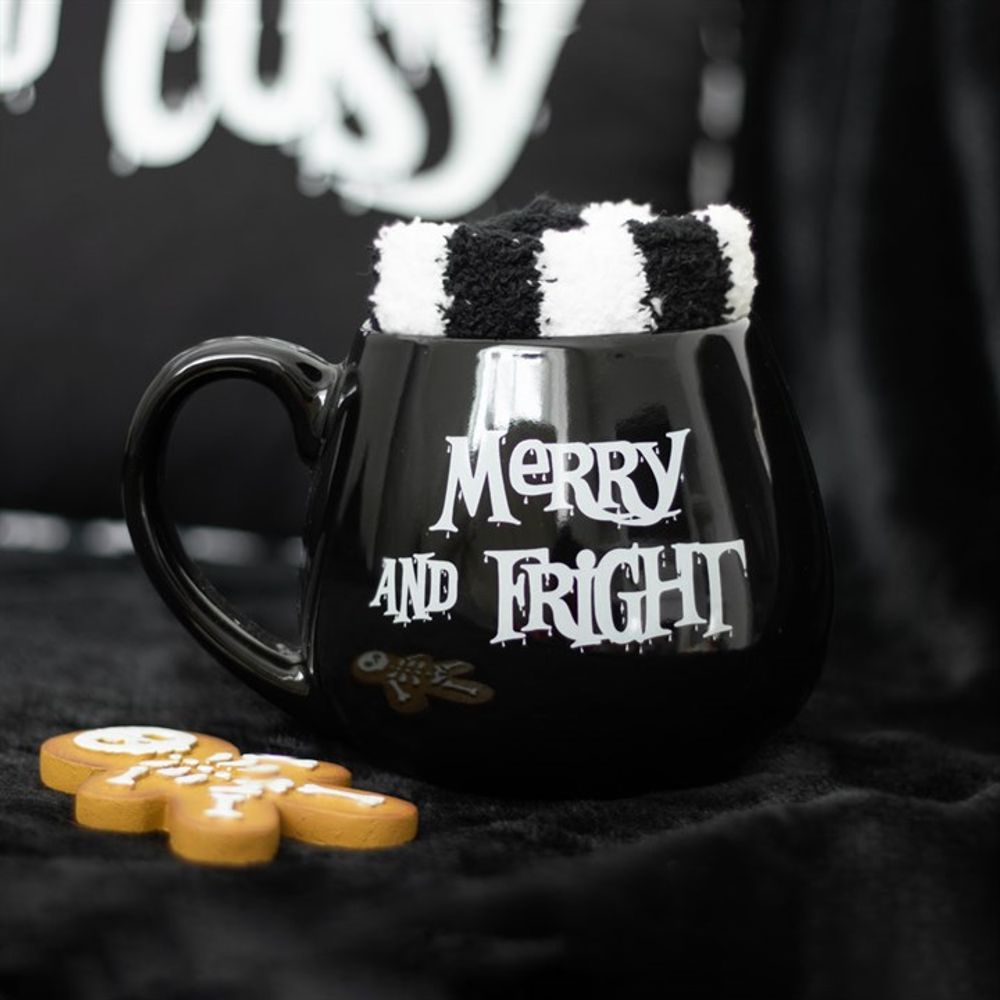 Close-up of the 'Merry and Fright' text on the black mug, echoing the season's spooky spirit.