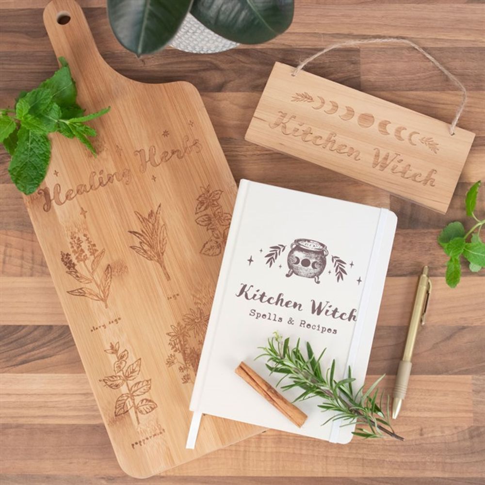 Elegant bamboo chopping board showcasing healing herbs used in witchcraft.