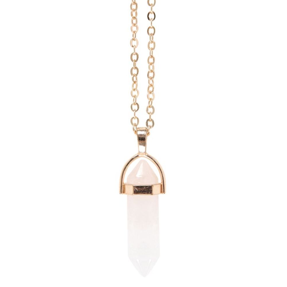Close-up of semi-precious clear quartz pendant on golden chain.