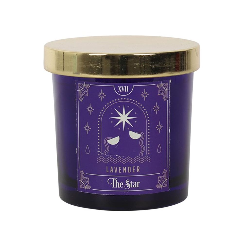 Close-up of the candle's gold lid detailing 'The Star' tarot card emblem.