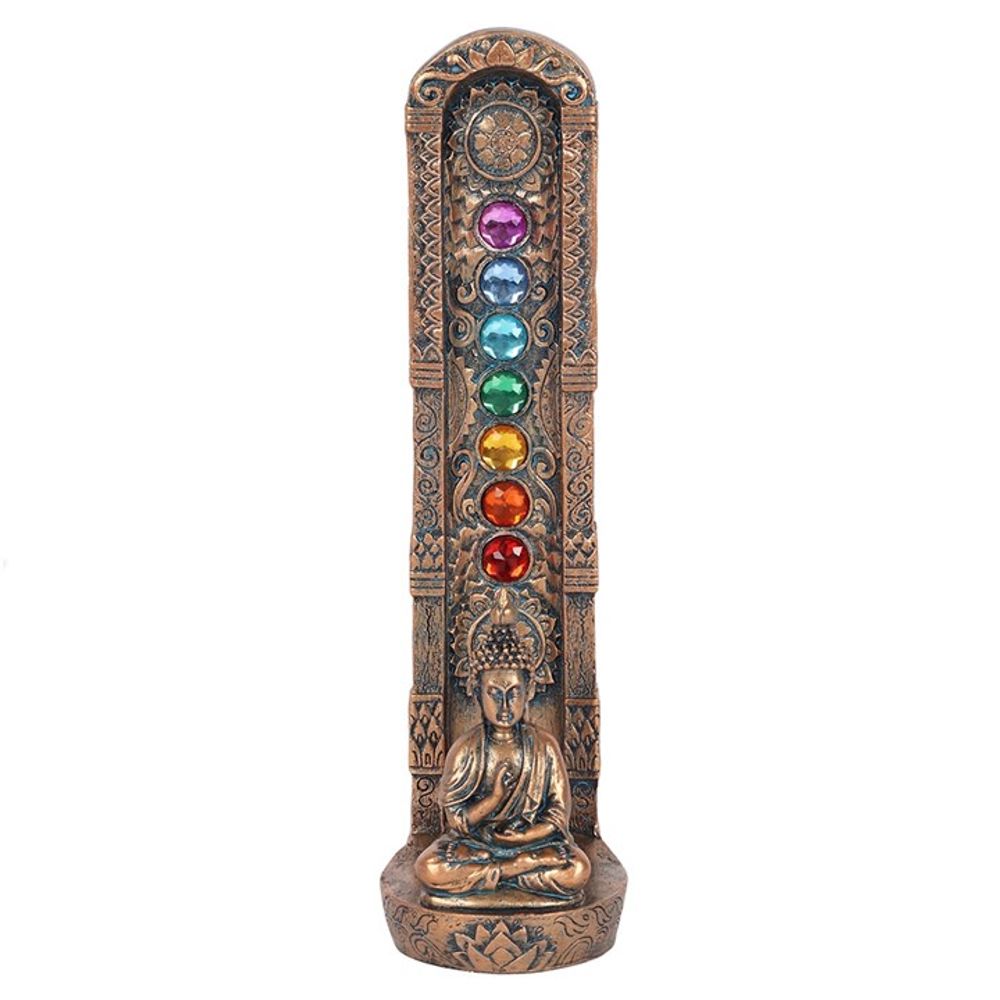 Close-up of the meditating Buddha figure surrounded by seven Chakra hues on the incense holder.